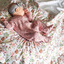 Load image into Gallery viewer, Dreaming of cute little bunnies in our Spring Floral Patch Blanket with Bunnies flannel back.