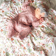 Load image into Gallery viewer, Dreaming of cute little bunnies in our Spring Floral Patch Blanket with Bunnies flannel back.