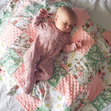 Load image into Gallery viewer, Your little one will have the sweetest of dreams while wrapped in our Spring Floral Patch Blanket with Flowers flannel back.
